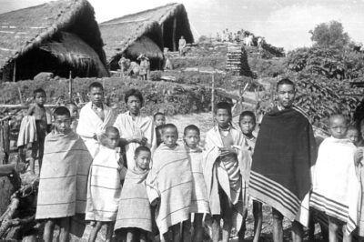 Group of Chakhesang Naga men and children, photographed by Christoph von Fürer-Haimendorf more than 80 years ago.